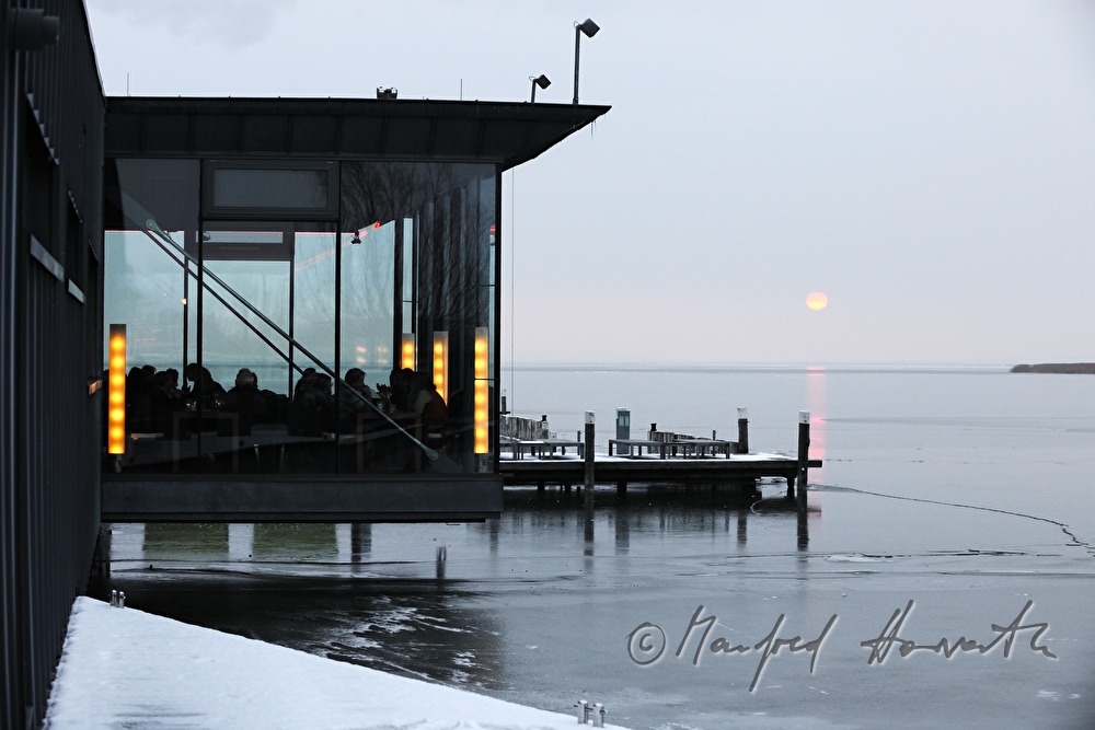 Mole West and sunset on icecovered lake