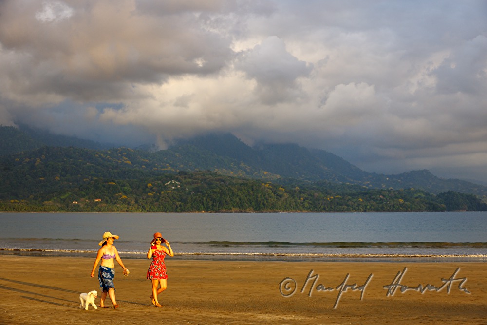 walkers on the beach of the Pacific Ocean