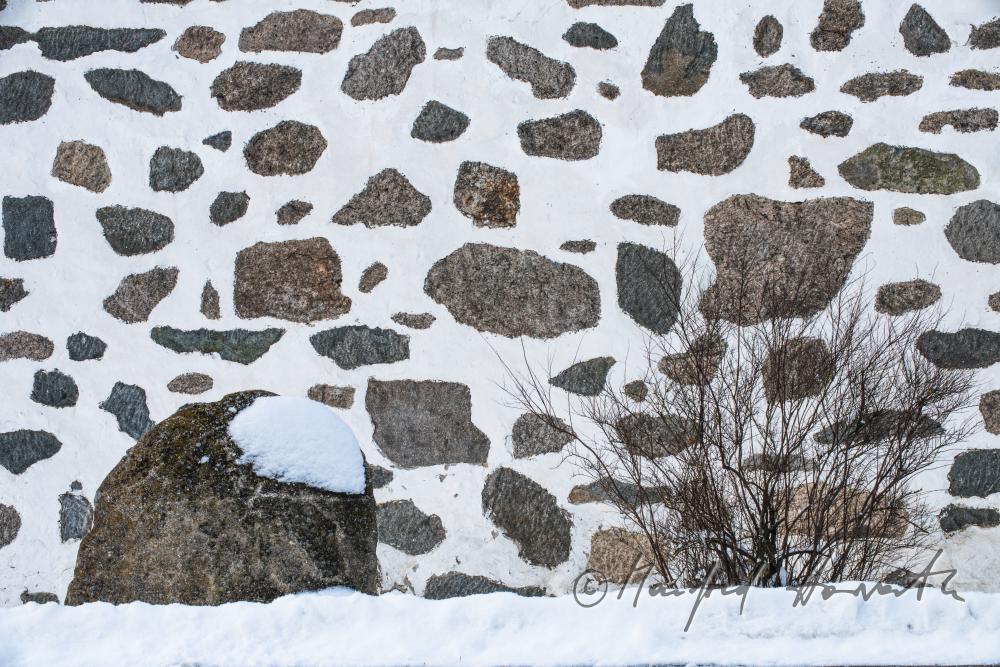 fassade of a typical farmhouse built of granite